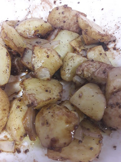 Una foto de Patatas al microondas con cebolla y semillas