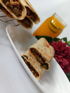 A picture of Saucy beef wraps.
