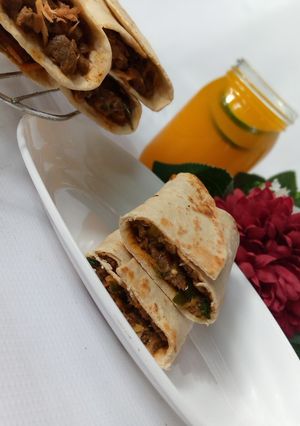 A picture of Saucy beef wraps.