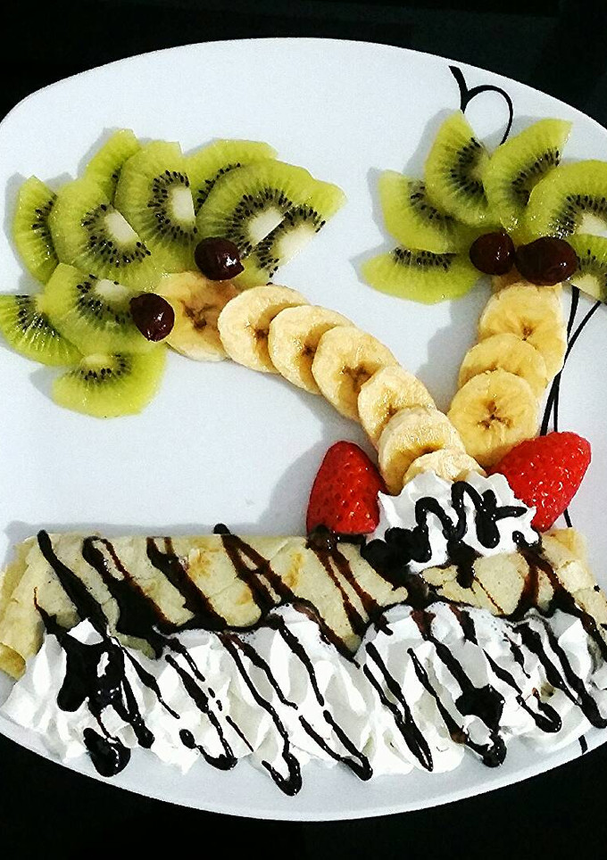 Una foto de Crepes dulces con frutas