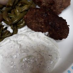 A picture of Ground Beef Croquettes with White Sauce.