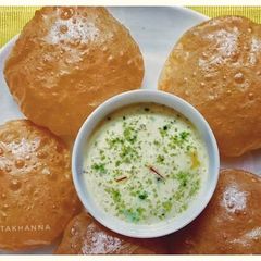 Atta Puri (with Hung curd water) A picture of Atta Puri (with Hung curd water).