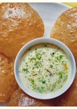 A picture of Atta Puri (with Hung curd water).