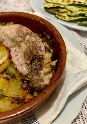 A picture of Oven-Baked Lamb with Potatoes.