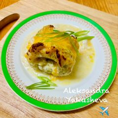 A picture of Cod rolls in creamy sauce.