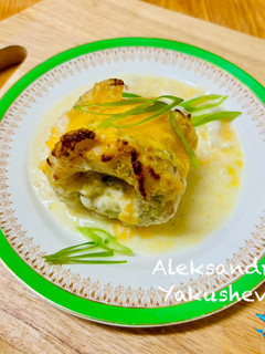 A picture of Cod rolls in creamy sauce.