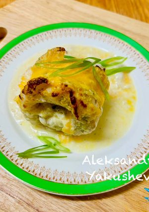 A picture of Cod rolls in creamy sauce.