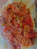 Ravioles con salsa boloñesa