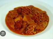 Una foto de callos en salsa picante