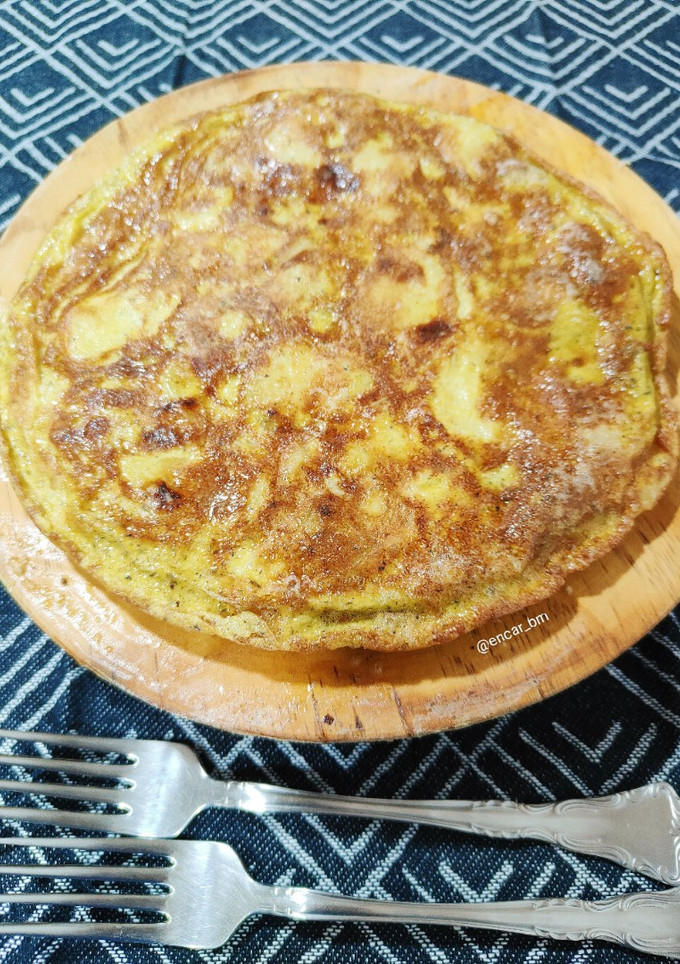 Una foto de Tortilla trufada de patata y cebolla