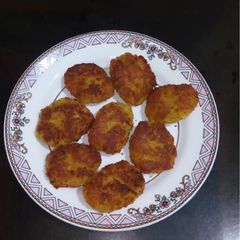 A picture of Narkel - er Bara / Coconut Fritters.