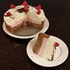 A picture of Chocolate / Rasberry / White Chocolate No Bake Cheesecake.