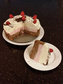 A picture of Chocolate / Rasberry / White Chocolate No Bake Cheesecake.