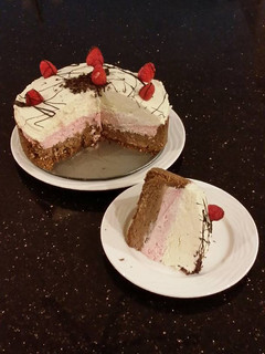 A picture of Chocolate / Rasberry / White Chocolate No Bake Cheesecake.
