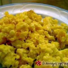 A picture of Scrambled eggs with feta cheese.