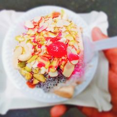 A picture of Kulfi falooda with dry fruit and rose syrup.
