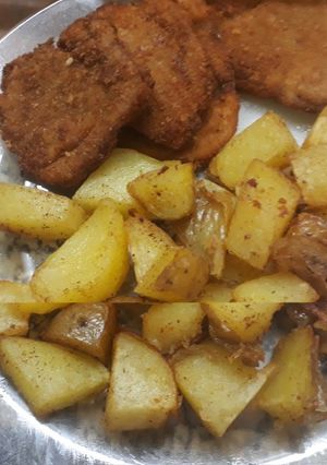 Una foto de Papas rústicas para acompañar