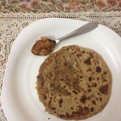A picture of Yogurt aaloo stuffed paratha.