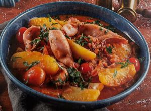 Foto de Lulas com batatas e tomates-cereja
