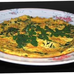 Omlet with spiced onions, drumstick leaves and lemon juice A picture of Omlet with spiced onions, drumstick leaves and lemon juice.