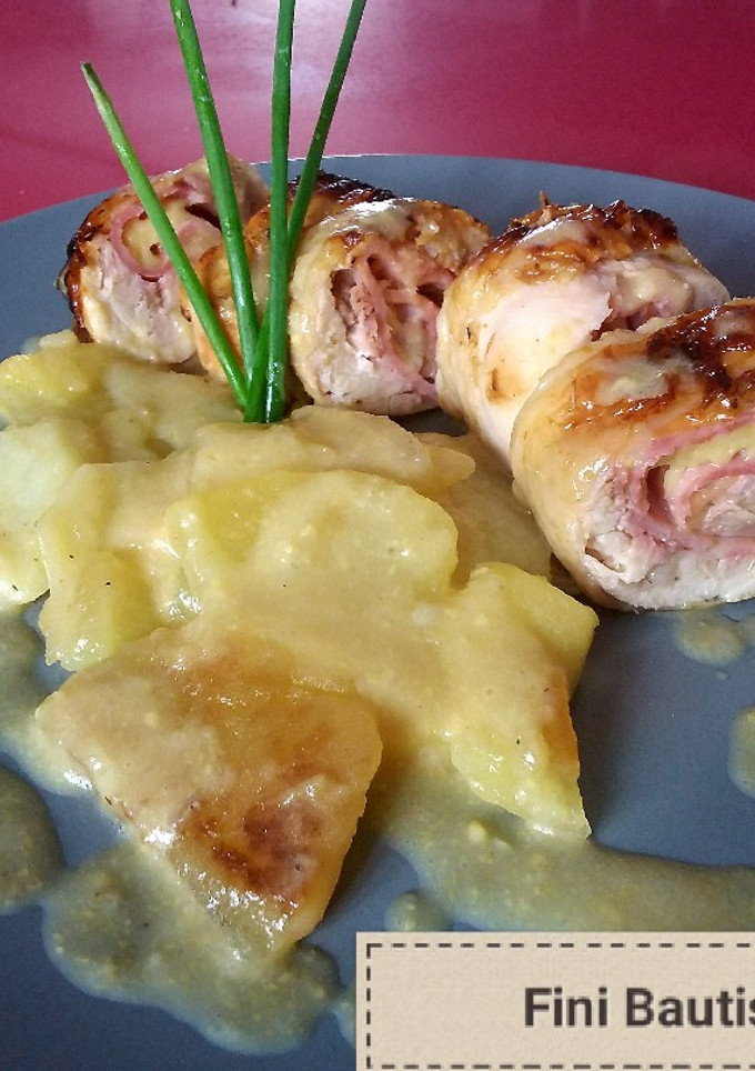 Una foto de Muslos de pollo rellenos con patatas panaderas