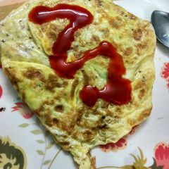 Egg wrapped fried rice | omurice rice/Omelette rice A picture of Egg wrapped fried rice | omurice rice/Omelette rice.