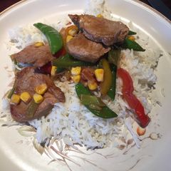 A picture of Stir fried Pork with spring onions and sugar snaps.