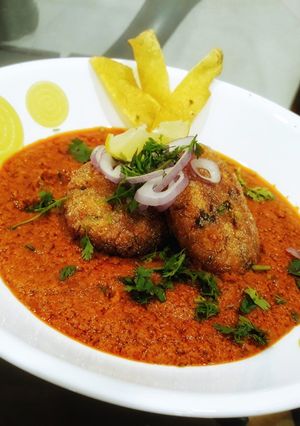 A picture of Yam Kofte with Spicy Coconut Curry and Yam Crispies.