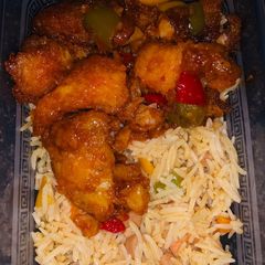 Stir fried basmati rice and sweet and sour fish fillet A picture of Stir fried basmati rice and sweet and sour fish fillet.