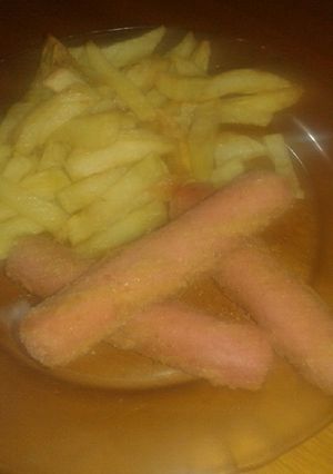 Una foto de Salchichas rebozadas con fritas