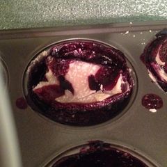A picture of Mini blueberry pies.
