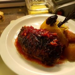 A picture of Duck in cranberry ginger sous.