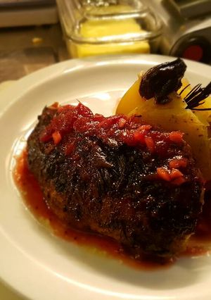 A picture of Duck in cranberry ginger sous.