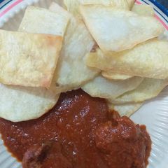 A picture of Fried yam with stew.