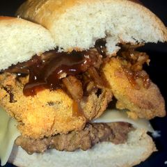 Cow boy burger on French loaf A picture of Cow boy burger on French loaf.