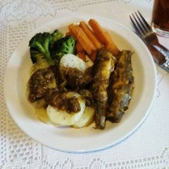 A picture of Curry Baby Hake in Tomato Pepper Sauce.