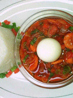 A picture of Boiled rice with simple tomato stew.