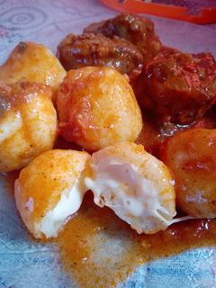 Una foto de Ñoquis rellenos de queso