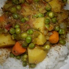 A picture of Spicy Potato Curry with Carrots and Peas.