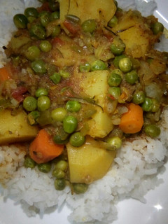 A picture of Spicy Potato Curry with Carrots and Peas.