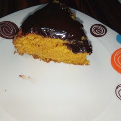 A picture of Carrot cake with chocolate ganache.