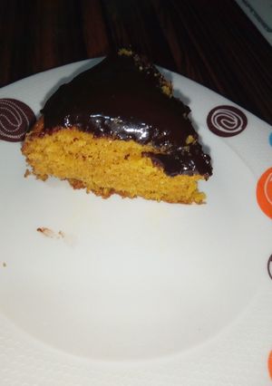 A picture of Carrot cake with chocolate ganache.