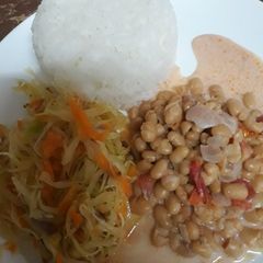 A picture of Rice, steamed cabbage and coconut beans.