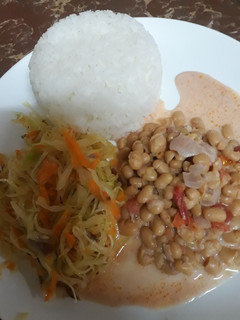 A picture of Rice, steamed cabbage and coconut beans.