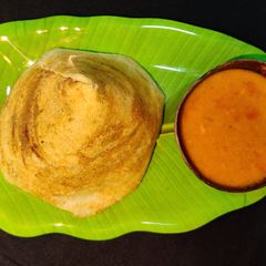 A picture of Tomato sambhar.