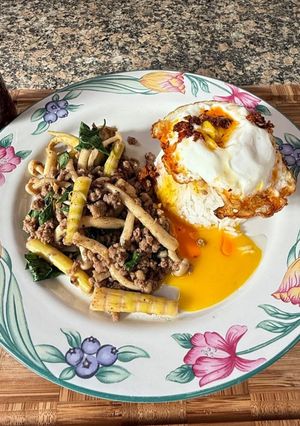 A picture of Stir-fry ground pork with bamboo shoots mushroom and basil.