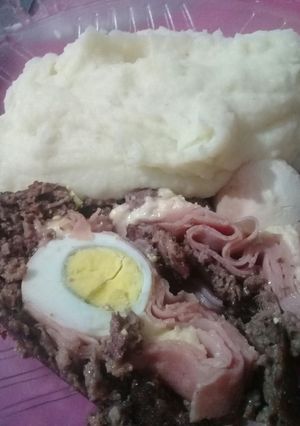 A picture of Stuffed Meatloaf with Mashed Potatoes.