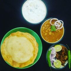 A picture of Special Lunch : Choley, Bhature, Boondi Onion Raita.
