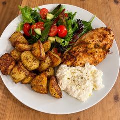 A picture of Crispy Greek chicken with lemon potatoes & whipped feta salad.