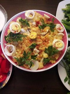 A picture of Boiled Potatoes with Boiled Eggs, Garlic, and Spices.